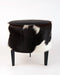 Small footstool in black and white cowhide