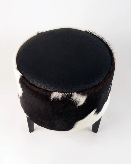 Small footstool in black and white cowhide