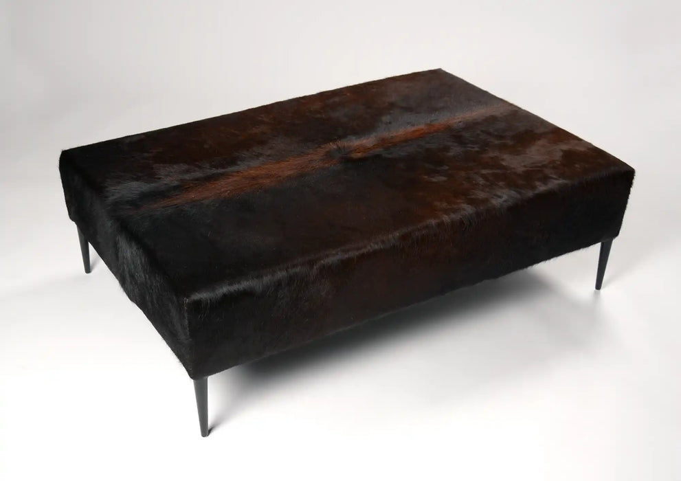 Dark cowhide ottoman black metal legs