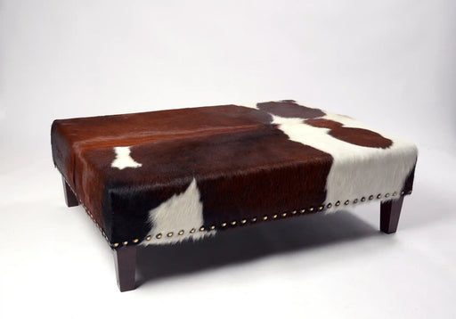 Beautiful large cowhide ottoman with studs