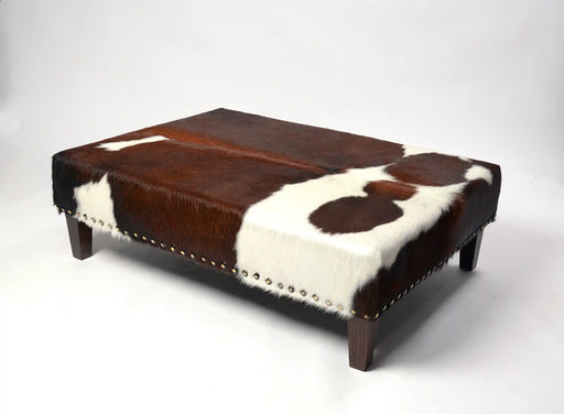 Beautiful cowhide ottoman with studs