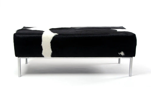 Black & white cowhide ottoman with metal feature rail base NZ made