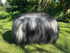 Icelandic sheepskin footstool on grass