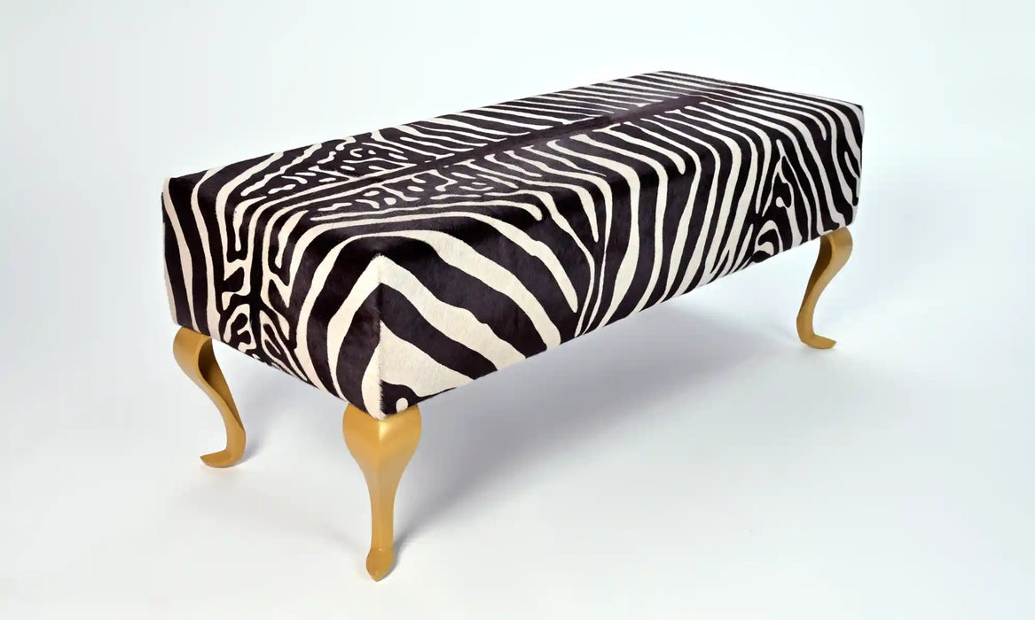 Zebra ottoman with gold legs