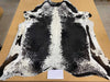 A beautiful black and white lineback cowhide rug