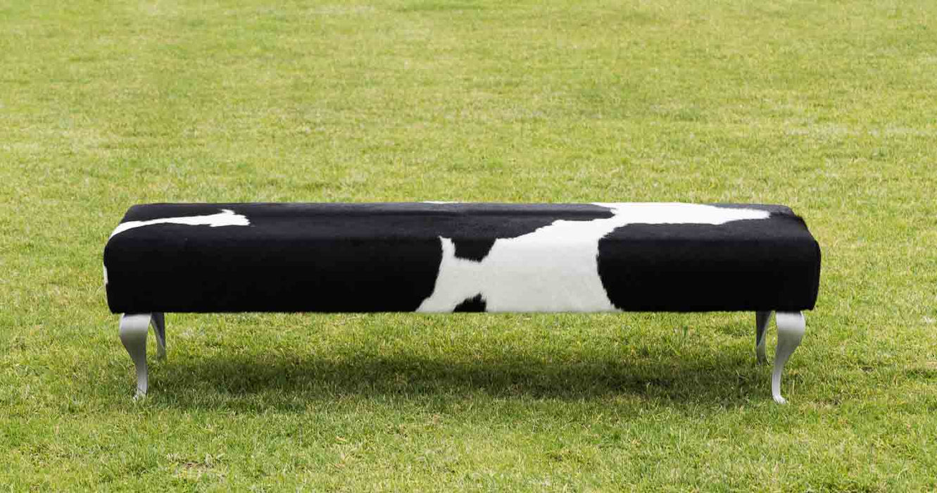 Large black & white cowhide bench seat ottoman with metal legs