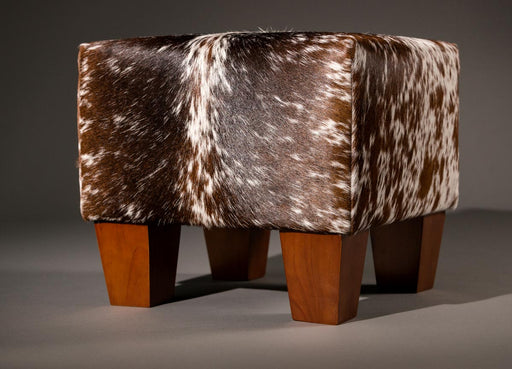 Cowhide footstool with wood legs