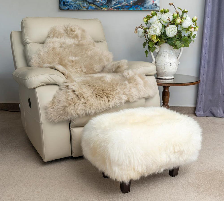 Stone beige sheepskin rug with footstool