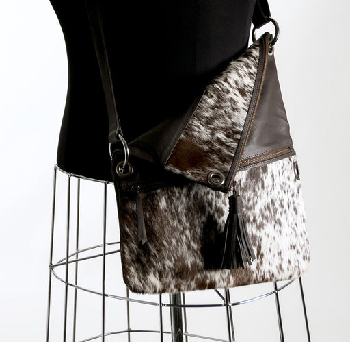 Brown and white cowhide handbag