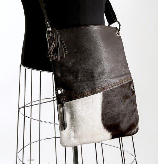 Brown and white cowhide handbag