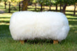 White Sheepskin Foot Rest with Light Wood Legs