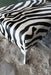 End of bed or bench zebra print cowhide ottoman